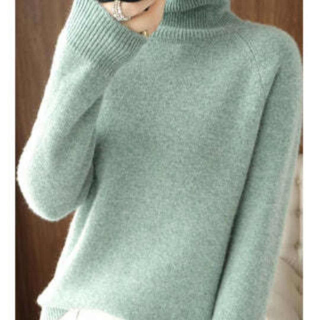 Pull-over en laine vert menthe, col roulé, manches longues, porté par une personne. Mode hiver, vêtement chaud et confortable.