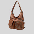 Sac à main en cuir marron avec bandoulière, poches zippées et cloutées, design moderne et élégant, accessoire mode femme tendance.