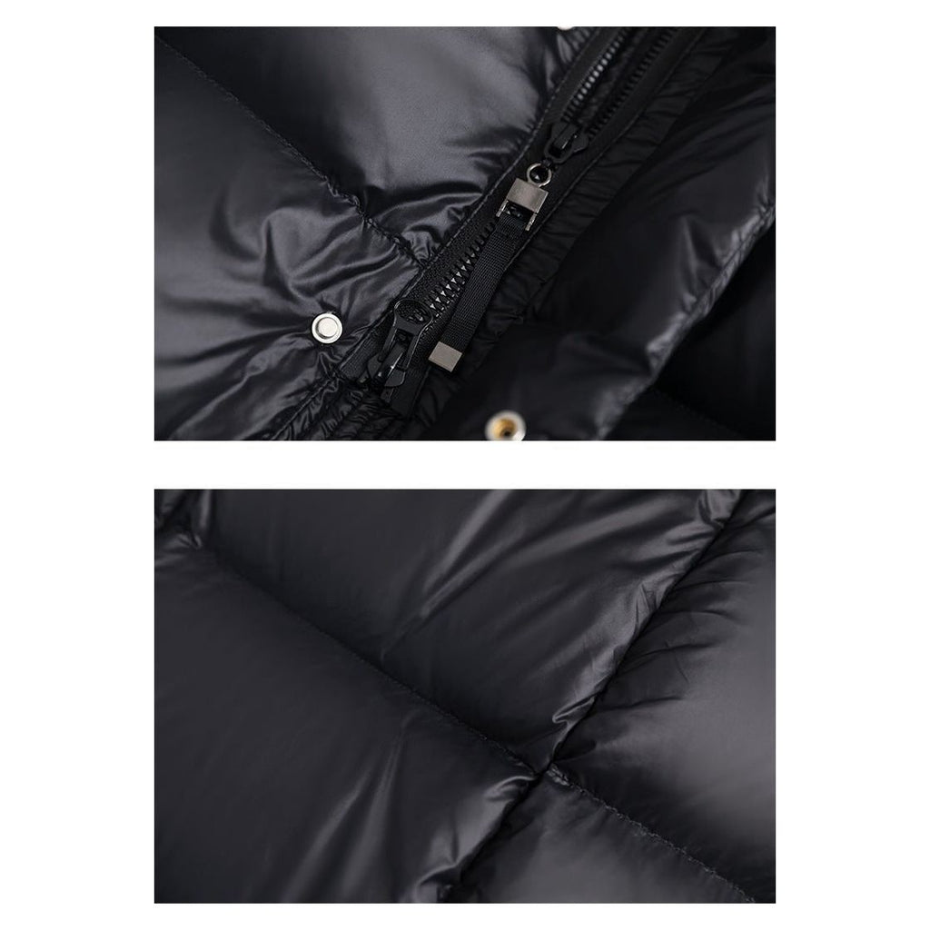 Doudoune noire en gros plan, détails de la fermeture éclair et du tissu matelassé. Mode hiver, vêtement chaud, style moderne.