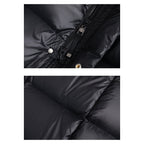 Doudoune noire en gros plan, détails de la fermeture éclair et du tissu matelassé. Mode hiver, vêtement chaud, style moderne.