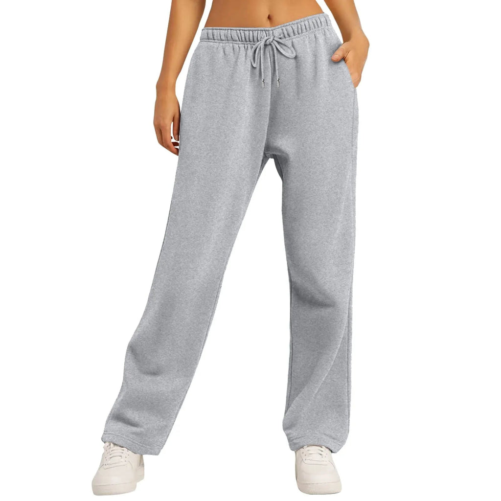 Pantalon de jogging gris pour femme, taille élastique avec cordon, coupe ample, confortable et décontracté, idéal pour sport et détente.