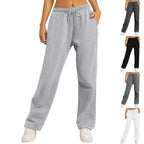 Pantalon de jogging gris pour femme, taille élastique avec cordon, disponible en plusieurs couleurs. Confortable et tendance pour le sport ou détente.