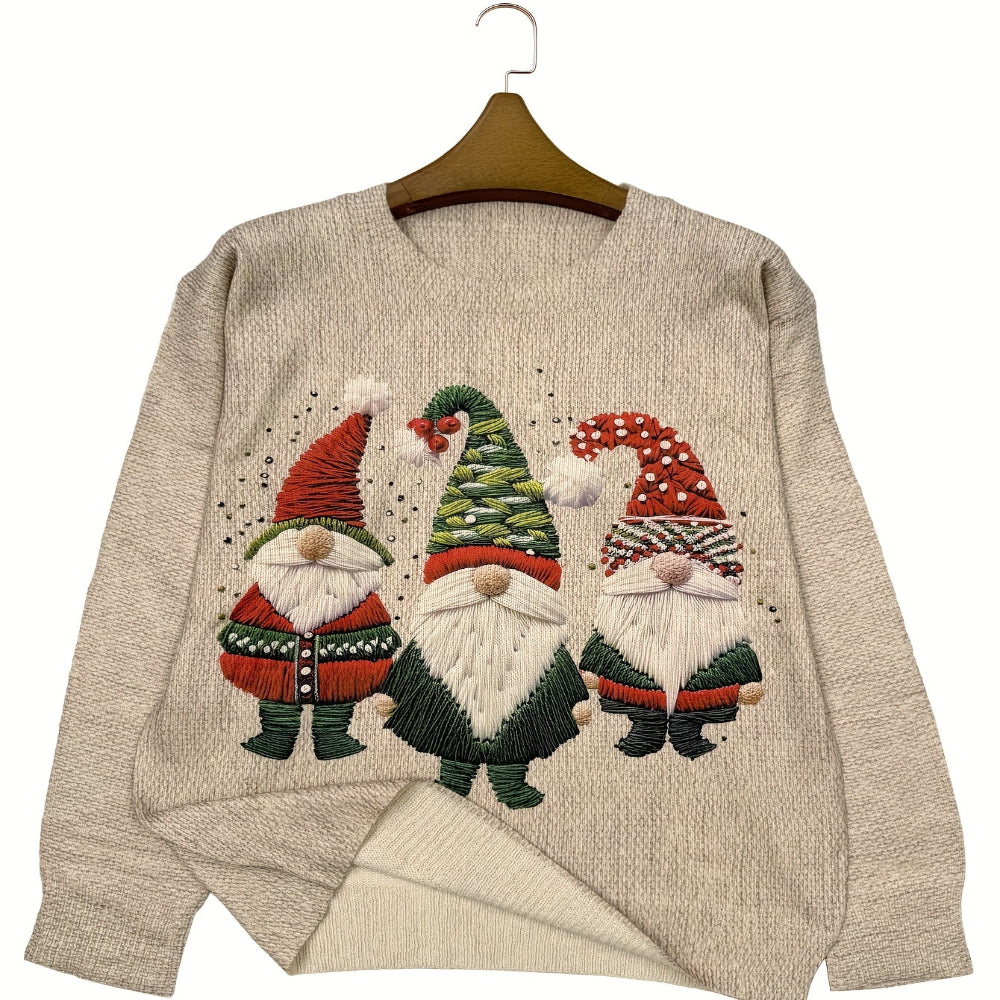 Pull beige avec motif de trois gnomes de Noël colorés, portant des chapeaux festifs. Design amusant et saisonnier, idéal pour les fêtes hivernales.