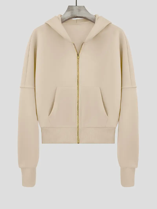 Sweat à capuche beige pour femme, fermeture éclair dorée, poches avant, manches longues, style décontracté, mode automne-hiver.