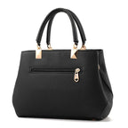 Sac à main noir élégant en cuir texturé avec poignées doubles et fermetures dorées, idéal pour la mode féminine et les accessoires tendance.