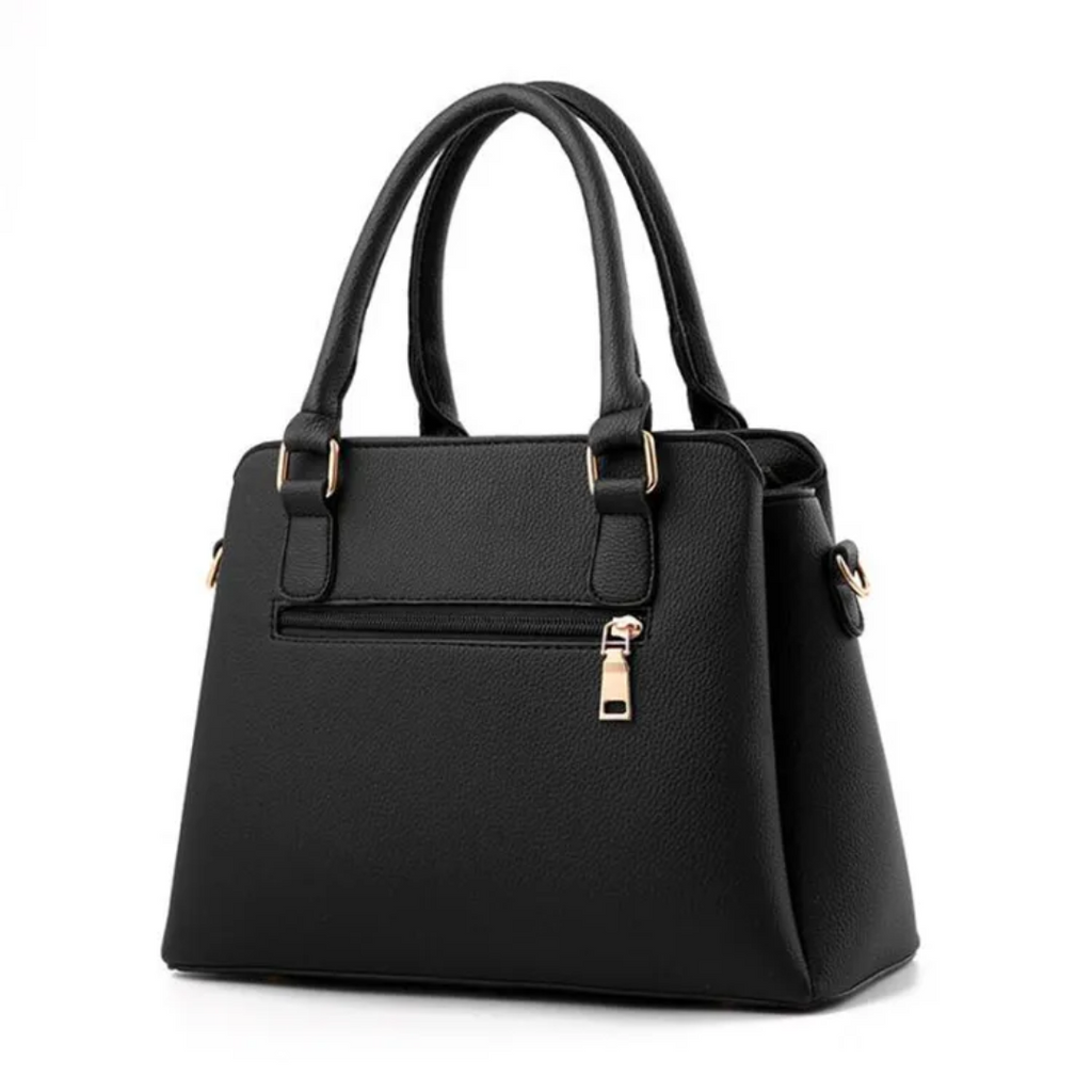 Sac à main noir élégant en cuir synthétique avec poignées doubles, fermeture éclair dorée et poche avant. Accessoire mode femme chic et moderne.