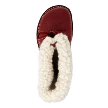 Botte rouge en cuir pour enfant avec doublure en fourrure blanche, vue de dessus. Chaussure d'hiver chaude et confortable.