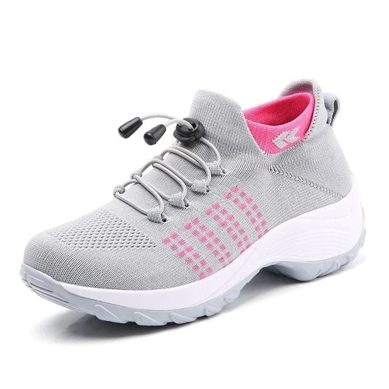Chaussure de sport grise et rose pour femme, semelle épaisse antidérapante, lacets élastiques, idéale pour course et fitness.