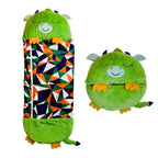 Sac de couchage enfant vert en forme de dinosaure, motif géométrique coloré, transformable en coussin. Idéal pour camping, voyage, chambre d'enfant.