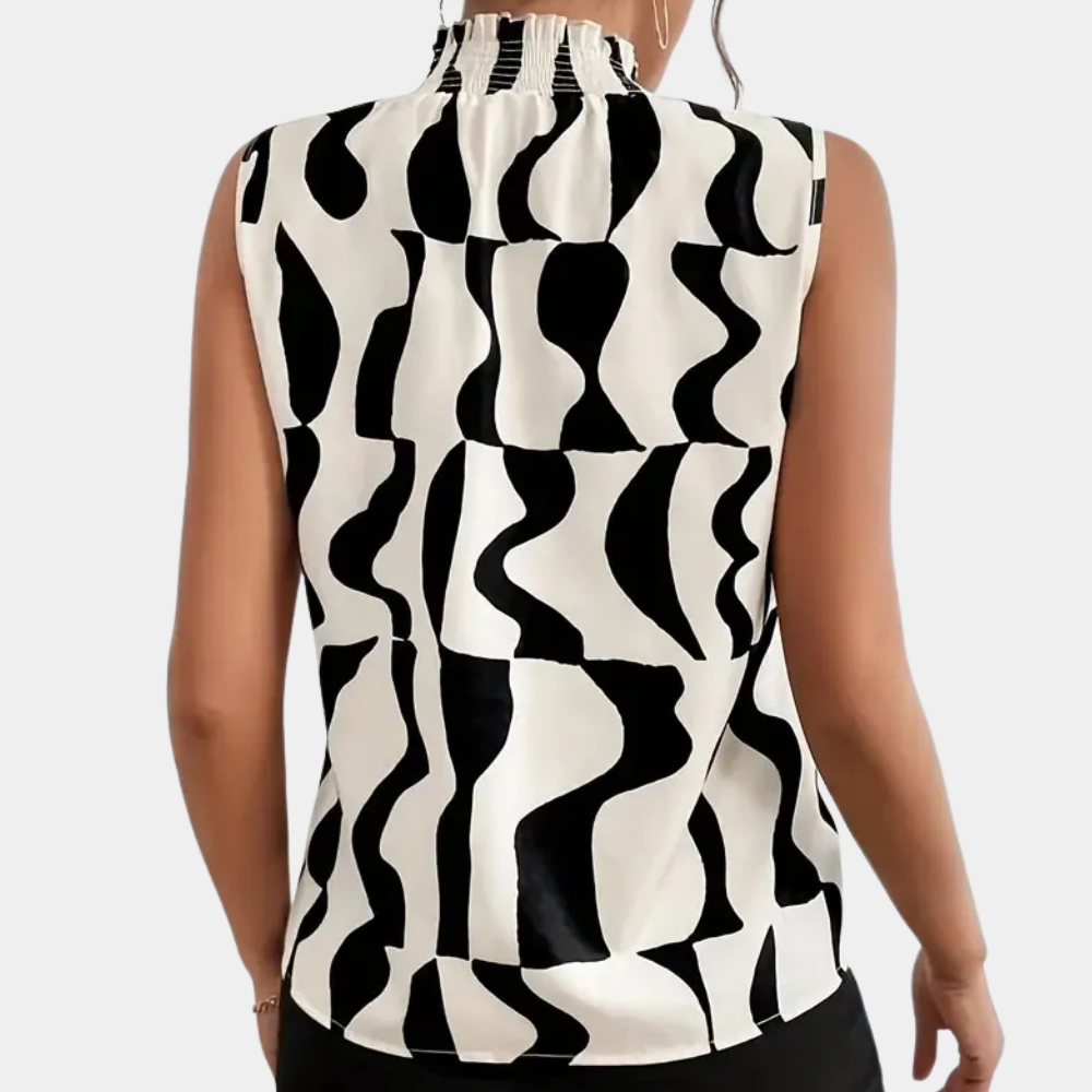 Haut sans manches noir et blanc à motifs géométriques ondulés, col plissé, style moderne et élégant, mode féminine tendance.