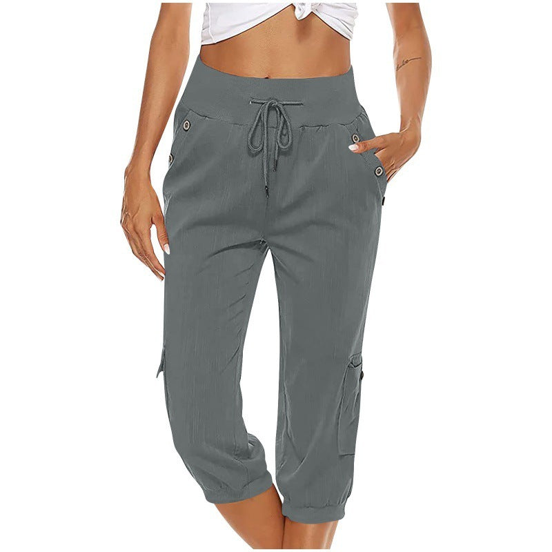 Pantalon capri gris pour femme, taille élastique avec cordon, poches latérales, style décontracté, idéal pour l'été et les activités sportives.