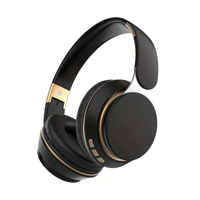 Casque audio sans fil noir élégant avec accents dorés, coussinets rembourrés, commandes intégrées. Accessoire high-tech pour musique et appels.