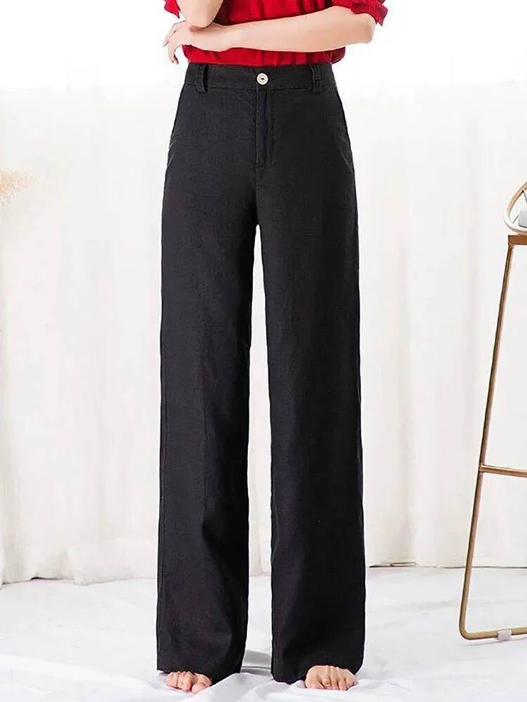 Pantalon large noir femme, taille haute, style décontracté, tissu léger, idéal pour mode automne-hiver, confort et élégance assurés.
