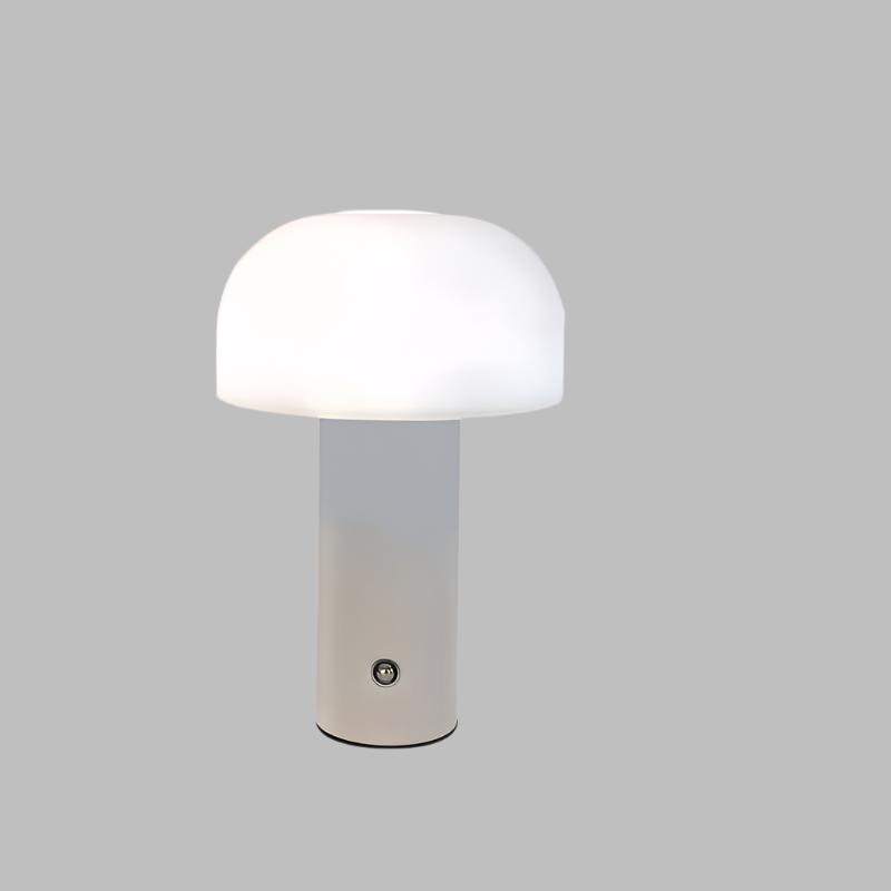 Lampe de table moderne en forme de champignon, abat-jour blanc, base cylindrique grise, design minimaliste, éclairage intérieur élégant.
