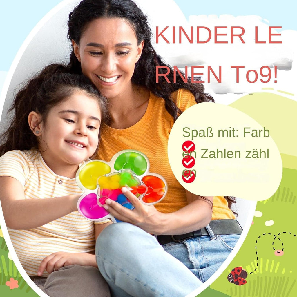 Mère et fille jouant avec un jouet éducatif coloré, idéal pour l'apprentissage des couleurs et des chiffres. Activité ludique pour enfants.