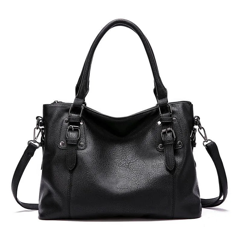 Sac à main en cuir noir élégant avec bandoulière amovible, détails de boucles métalliques, idéal pour mode féminine et accessoires tendance.