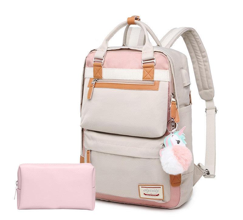 Sac à dos beige et rose avec porte-clés licorne, poches multiples et trousse assortie. Idéal pour école, voyage, mode féminine tendance.