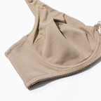 Soutien-gorge beige sans armatures, tissu doux, design confortable, idéal pour un maintien quotidien. Lingerie féminine élégante et pratique.