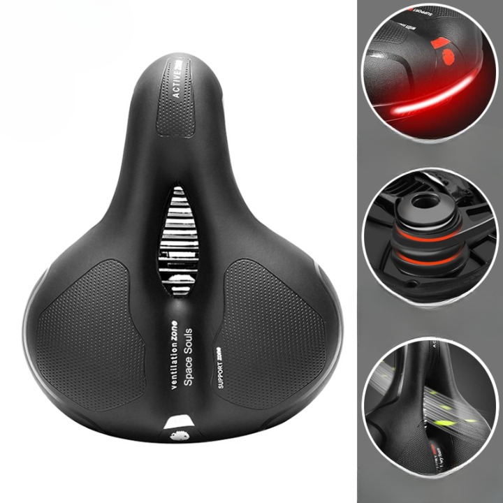 Selle de vélo ergonomique noire avec coussinets en gel, bandes réfléchissantes rouges, et suspension amortissante. Confort cycliste optimal.
