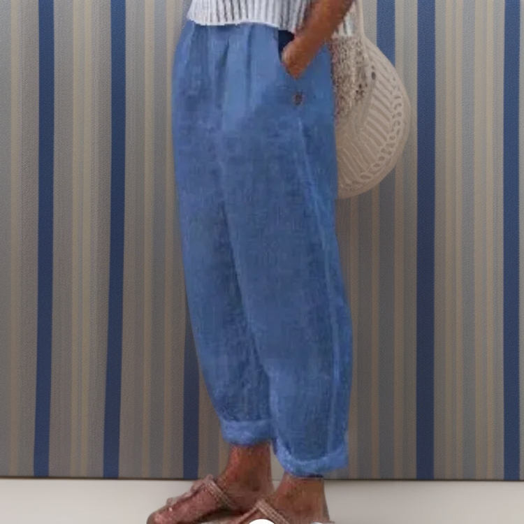Pantalon ample en lin bleu pour femme, style décontracté, avec poches latérales. Parfait pour l'été, confort et élégance assurés.