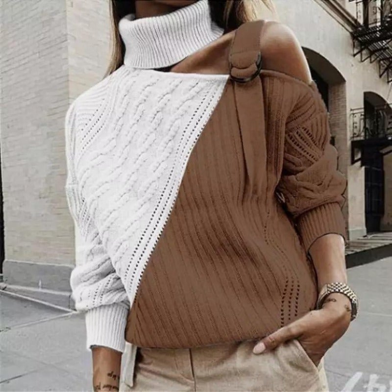 Femme portant un pull asymétrique bicolore blanc et marron, col roulé, manches longues, dans une rue urbaine. Mode automne-hiver tendance.