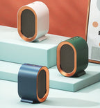 Trois mini chauffages électriques modernes, coloris rose, vert et bleu, posés sur des marches turquoise, design élégant et compact, intérieur tendance.