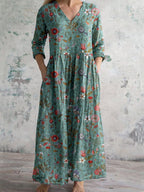 Robe longue bohème à manches longues, motif floral coloré sur fond vert, style décontracté et élégant, idéale pour l'été et les occasions décontractées.