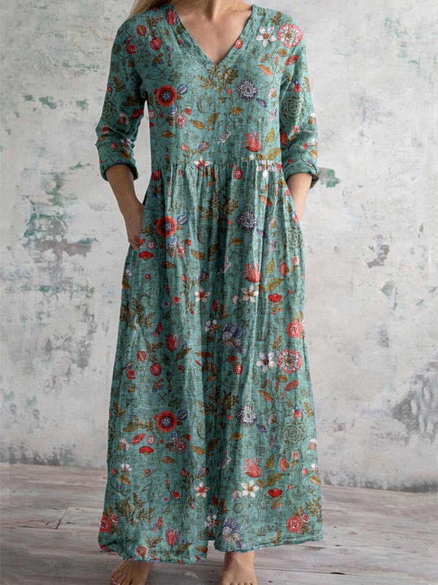 Robe longue bohème à manches longues, motif floral coloré sur fond vert, style décontracté et élégant, idéale pour l'été et les occasions décontractées.