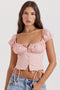 Top con volantes rosa bebé