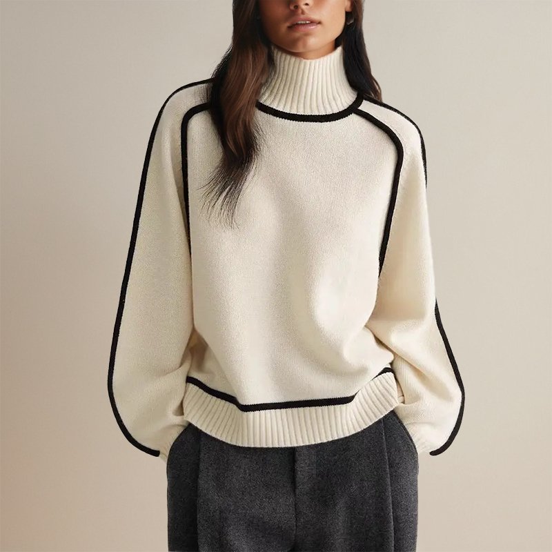 Femme portant un pull blanc à col roulé avec bordures noires, manches longues, style élégant et moderne, sur fond neutre. Mode automne-hiver tendance.