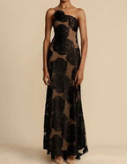 Robe longue bustier noire à motifs floraux, élégante et sophistiquée, idéale pour soirées et événements formels. Mode féminine chic et tendance.