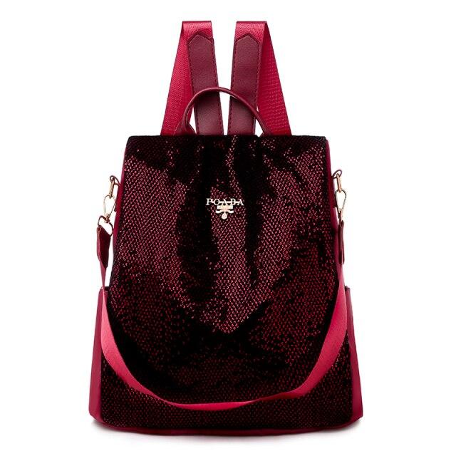 Sac à dos en paillettes bordeaux avec bretelles ajustables, design élégant et moderne, idéal pour la mode féminine et les accessoires tendance.