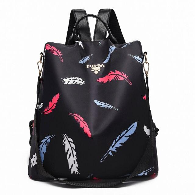 Sac à dos noir avec motif plumes colorées, design moderne et élégant, idéal pour la mode urbaine. Accessoire tendance pour femmes.