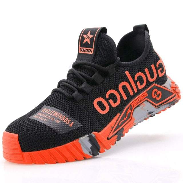 Basket noire et orange avec semelle épaisse, design moderne, logo "CONEGO" visible. Chaussure de sport tendance pour homme, style urbain.