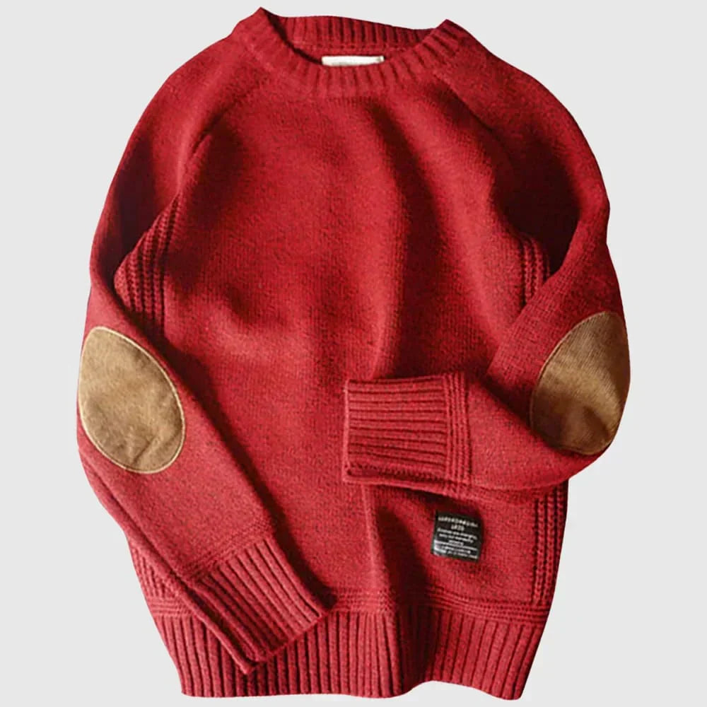 Pull rouge en laine avec coudières marron, manches longues, col rond, style décontracté. Mode automne-hiver, vêtement chaud et confortable.