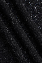 Tissu noir pailleté scintillant, texture brillante et élégante, idéal pour mode, couture, décoration. Effet glamour et sophistiqué.