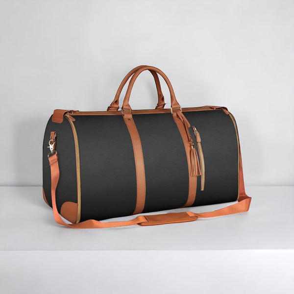 Sac de voyage en cuir noir et marron avec bandoulière, design élégant et moderne, idéal pour les escapades et les voyages d'affaires.