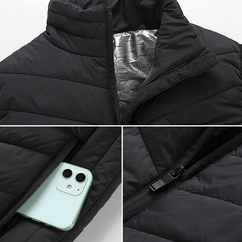 Veste matelassée noire avec doublure thermique argentée, poche zippée contenant un smartphone, fermeture éclair visible. Mode hiver, vêtements chauds.