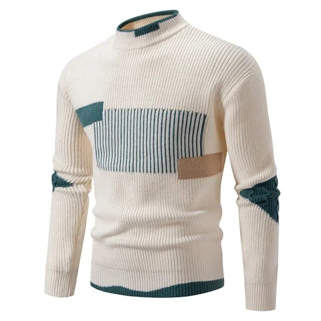 Pull en maille beige à col montant, motifs géométriques bleus et marron, manches longues. Mode homme automne-hiver, style moderne et élégant.