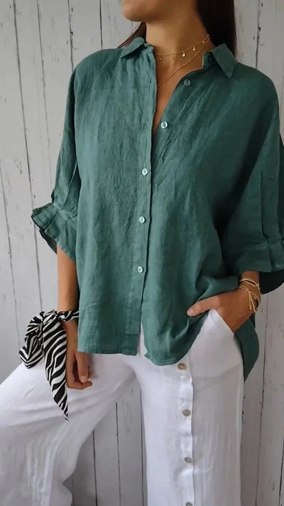 Camisa de mujer 100% lino, manga larga, cuello clásico, corte holgado.