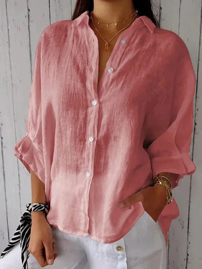 Camisa de mujer 100% lino, manga larga, cuello clásico, corte holgado.