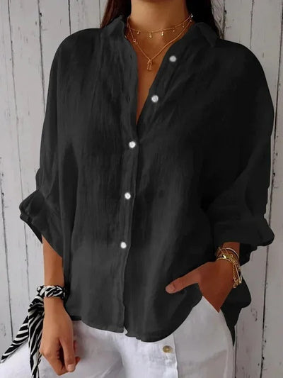 Camisa de mujer 100% lino, manga larga, cuello clásico, corte holgado.