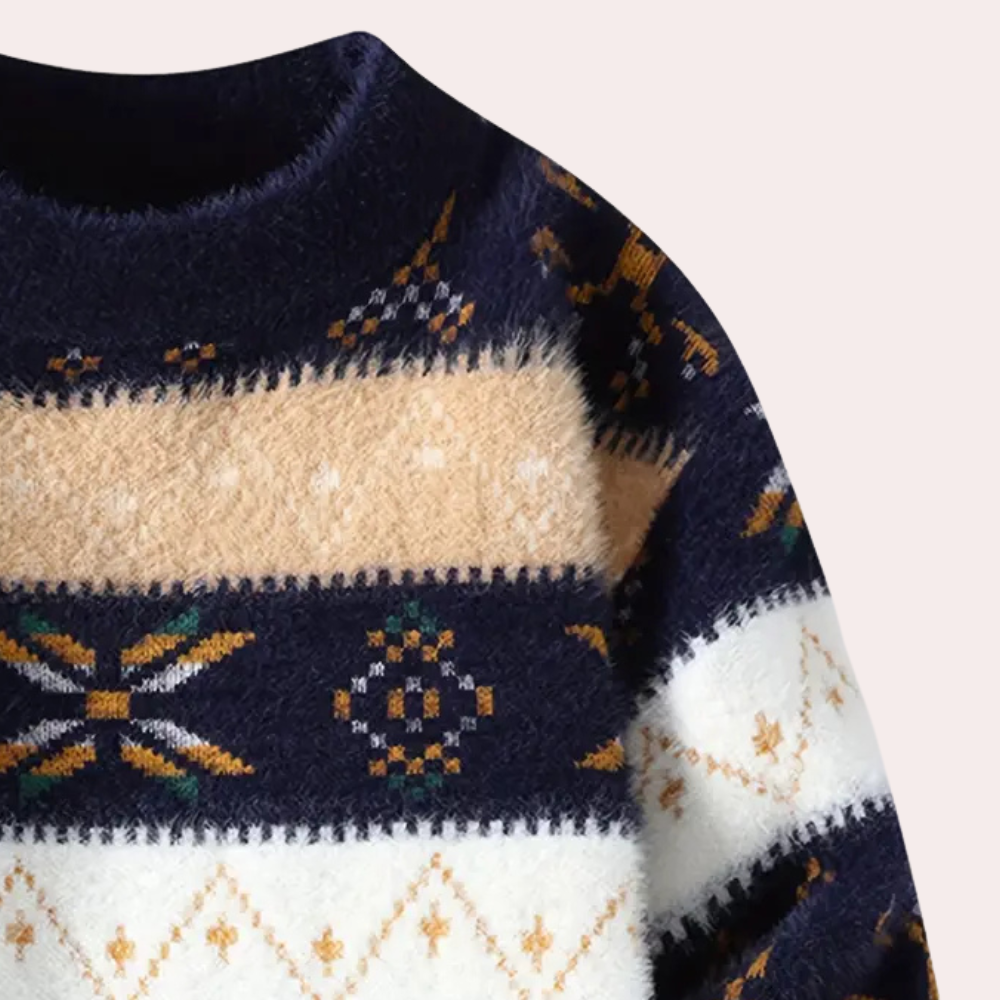 Pull-over en laine bleu marine avec motifs géométriques beige et blanc, style nordique, idéal pour l'hiver, mode tendance et confortable.